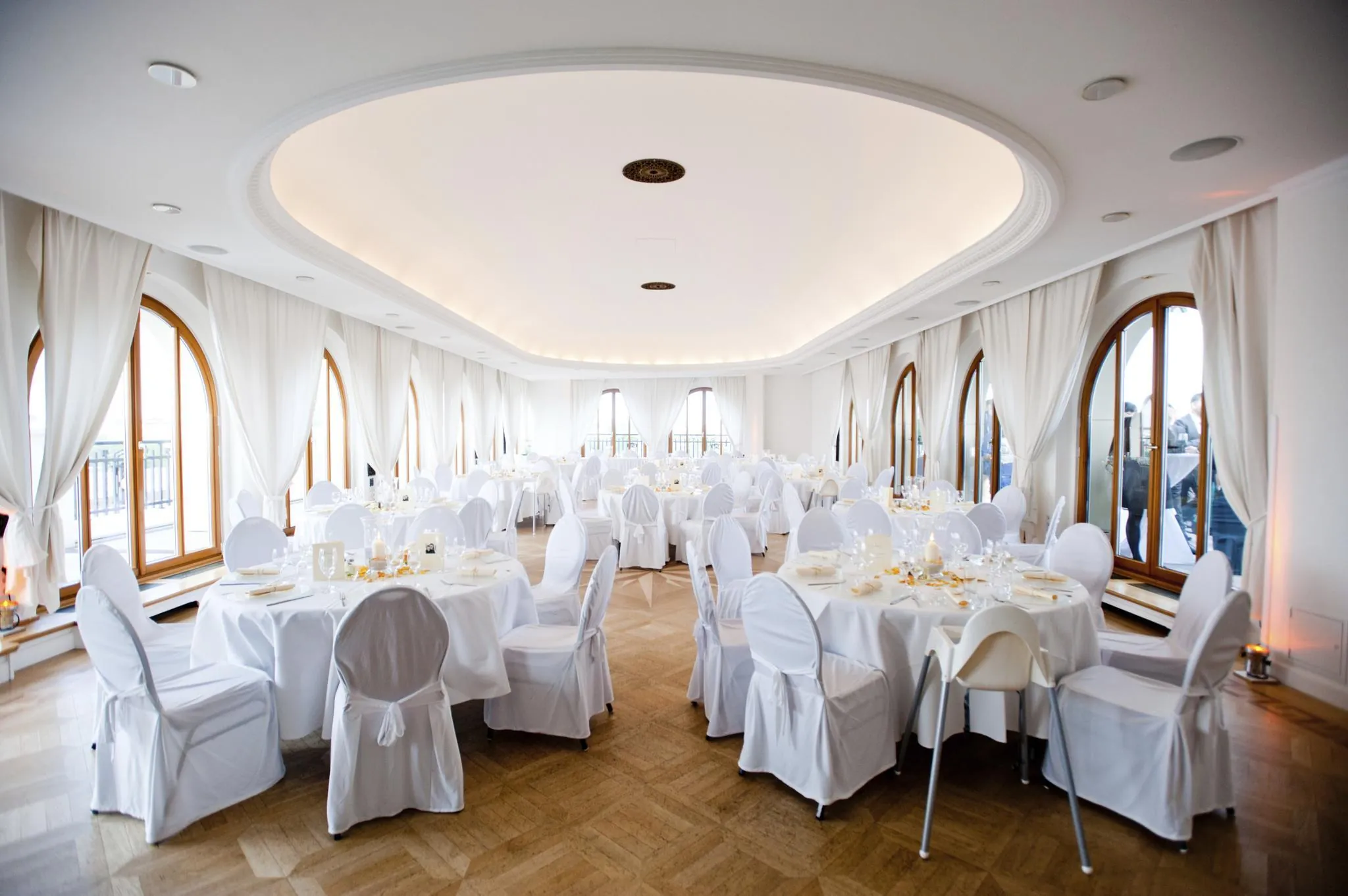 Guests seated at long tables during speeches