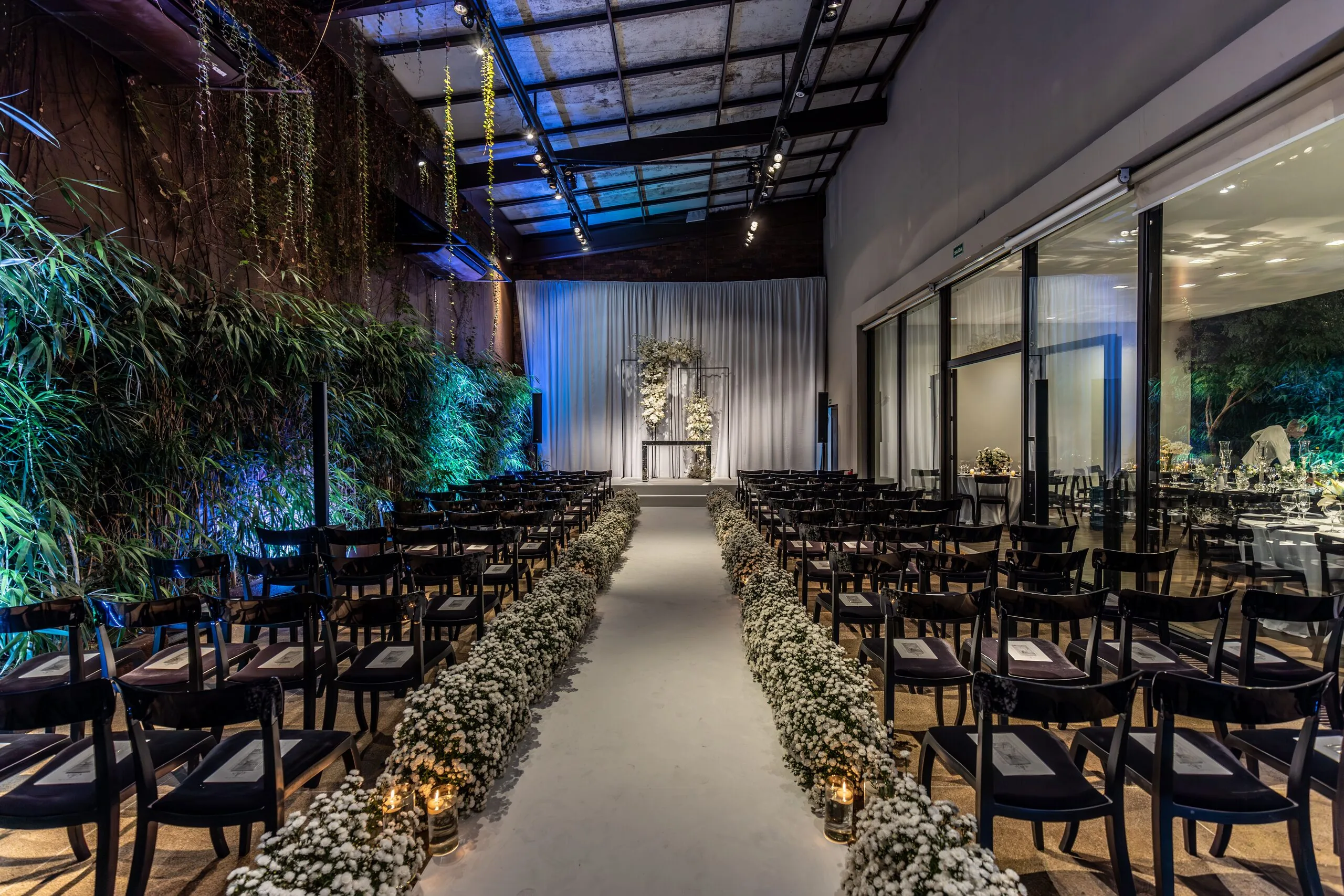 Floral installations above the ceremony aisle